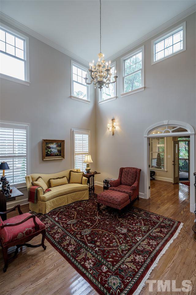 1901 Torrington Street Raleigh, NC 27615 - Photo 8 of 30 a living room with furniture chandelier and a window