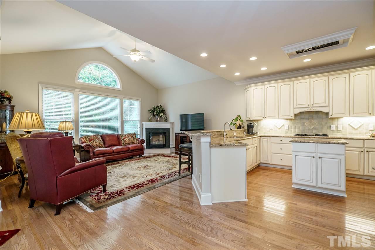 1901 Torrington Street Raleigh, NC 27615 - Photo 10 of 30 a living room with stainless steel appliances granite countertop furniture a couch a large window and kitchen view