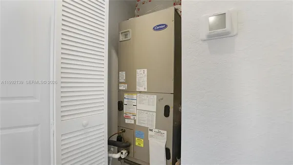 a view of staircase with white walls