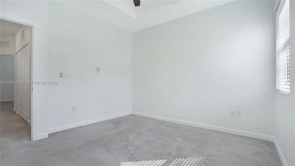 a bathroom with a shower and a sink
