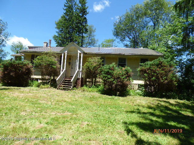 1957 Mack Road Kingsley, PA 18826 - Photo 1 of 31 a view of a chair and table in the garden