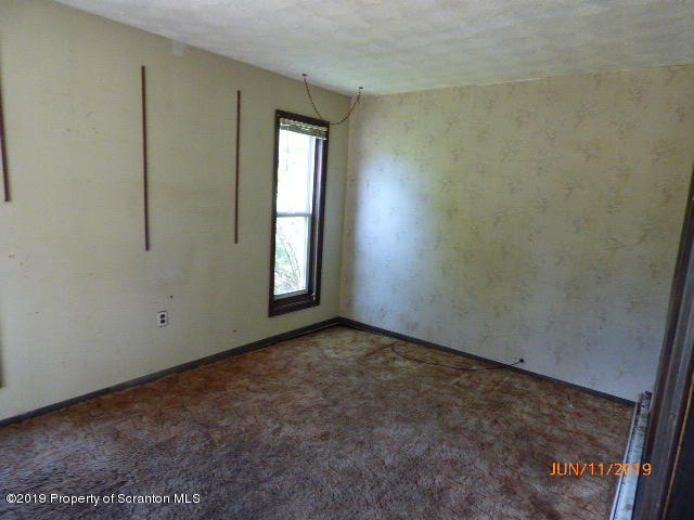 1957 Mack Road Kingsley, PA 18826 - Photo 13 of 31 an empty room with windows and closet