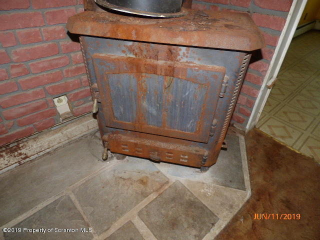 1957 Mack Road Kingsley, PA 18826 - Photo 14 of 31 a utility room with a wooden floor and white door