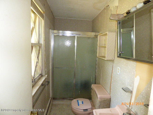 1957 Mack Road Kingsley, PA 18826 - Photo 18 of 31 a bathroom with a shower and toilet