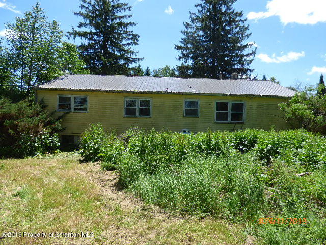 1957 Mack Road Kingsley, PA 18826 - Photo 5 of 31 a front view of a house with a yard