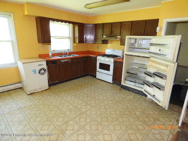 1957 Mack Road Kingsley, PA 18826 - Photo 9 of 31 a kitchen with stainless steel appliances a stove a sink and a refrigerator