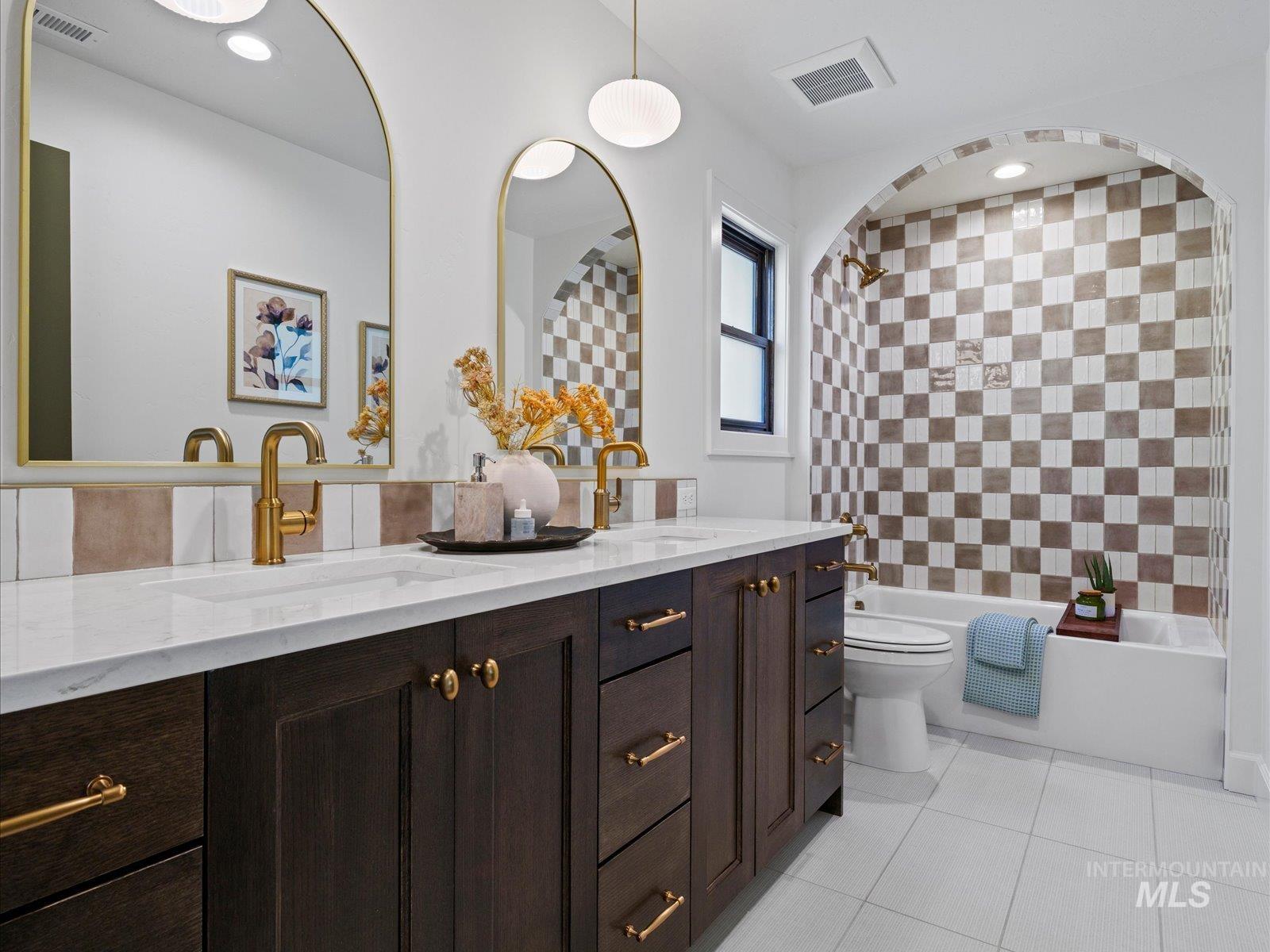 2834 West Cassia Street Boise, ID 83705 - Photo 10 of 15 Full bath with double vanity, light tile patterned floors, tub / shower combination, and recessed lighting