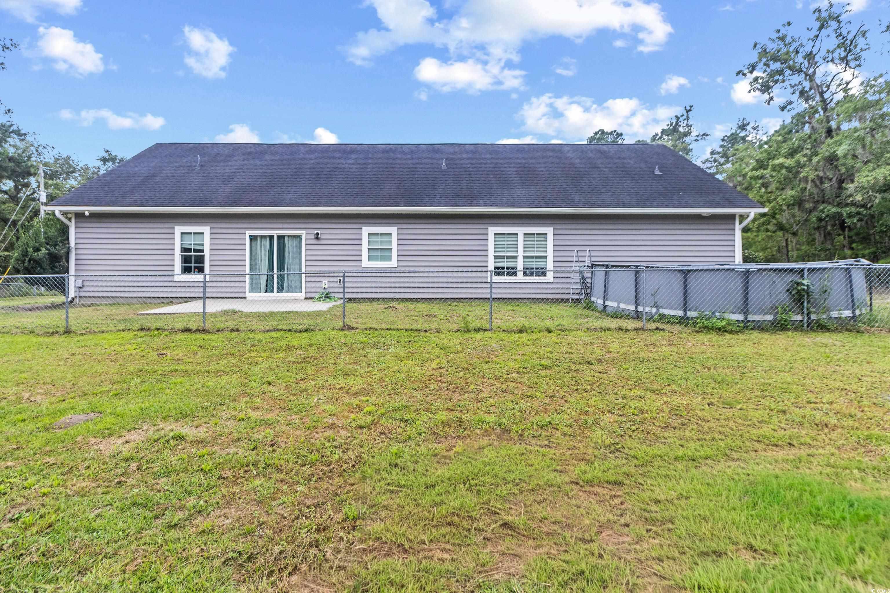 4867 Wolf Trail Conway, SC 29527 - Photo 23 of 31 Washroom featuring dark wood finished floors and washing machine and clothes dryer