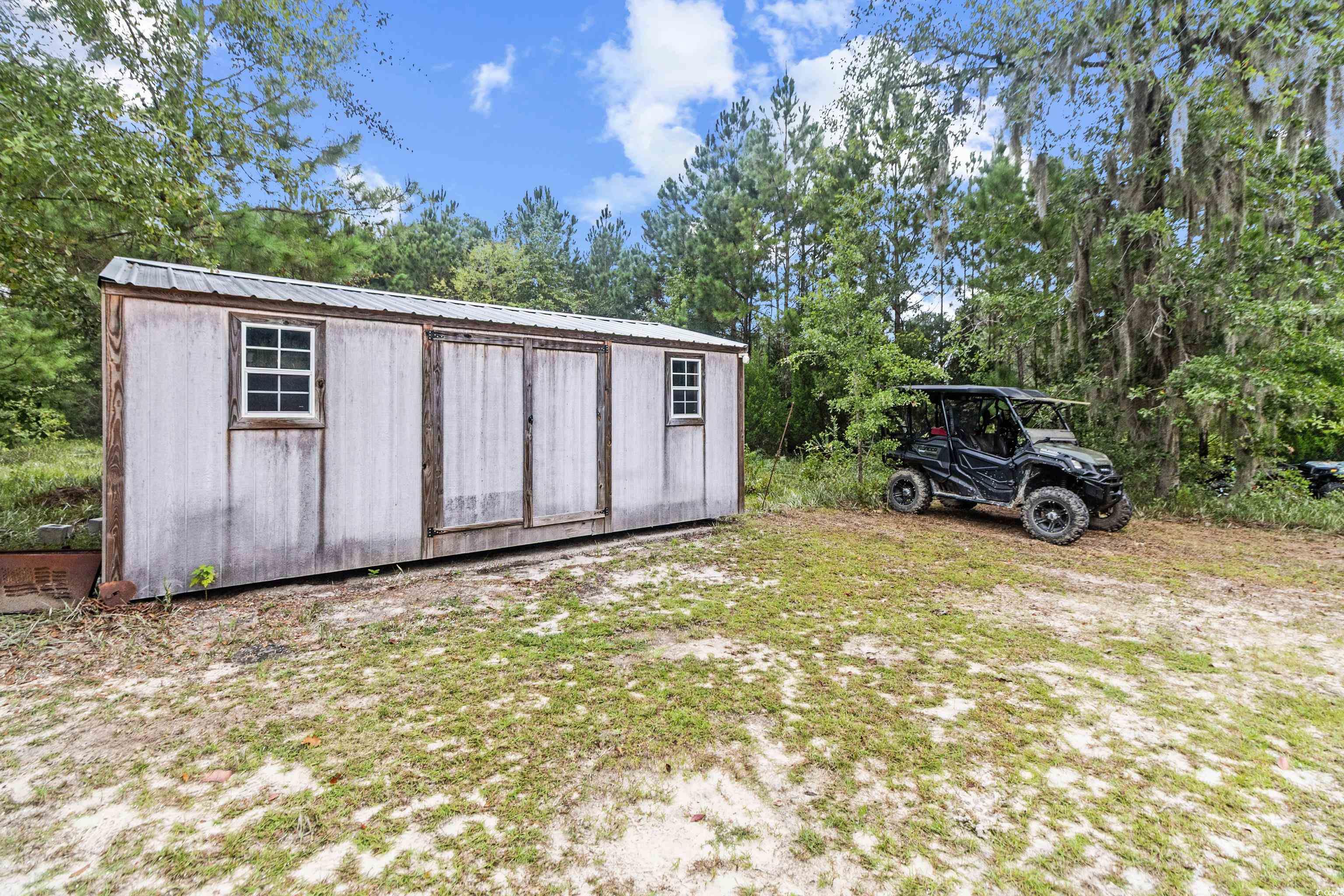 4867 Wolf Trail Conway, SC 29527 - Photo 25 of 31 Rear view of property with a patio and a fenced backyard