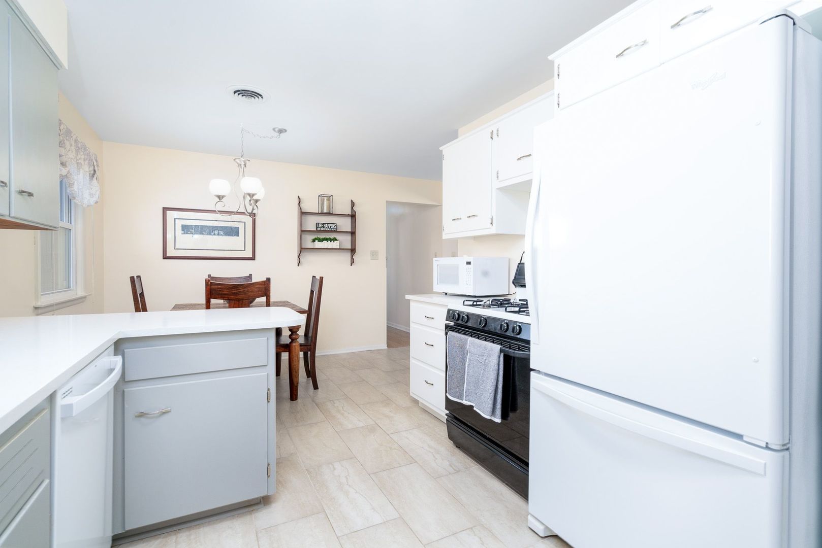 1008 Westminster Road Joliet, IL 60435 - Photo 16 of 28 a kitchen with cabinets and window