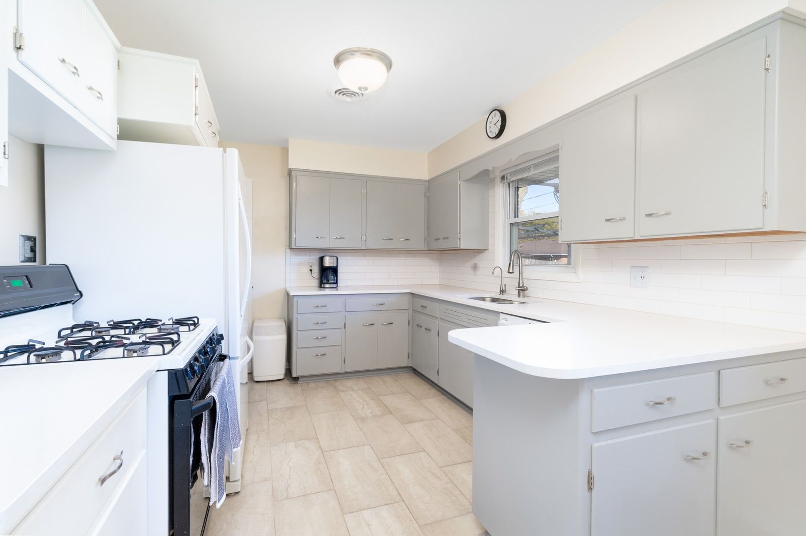 1008 Westminster Road Joliet, IL 60435 - Photo 17 of 28 a kitchen with a sink stove and cabinets