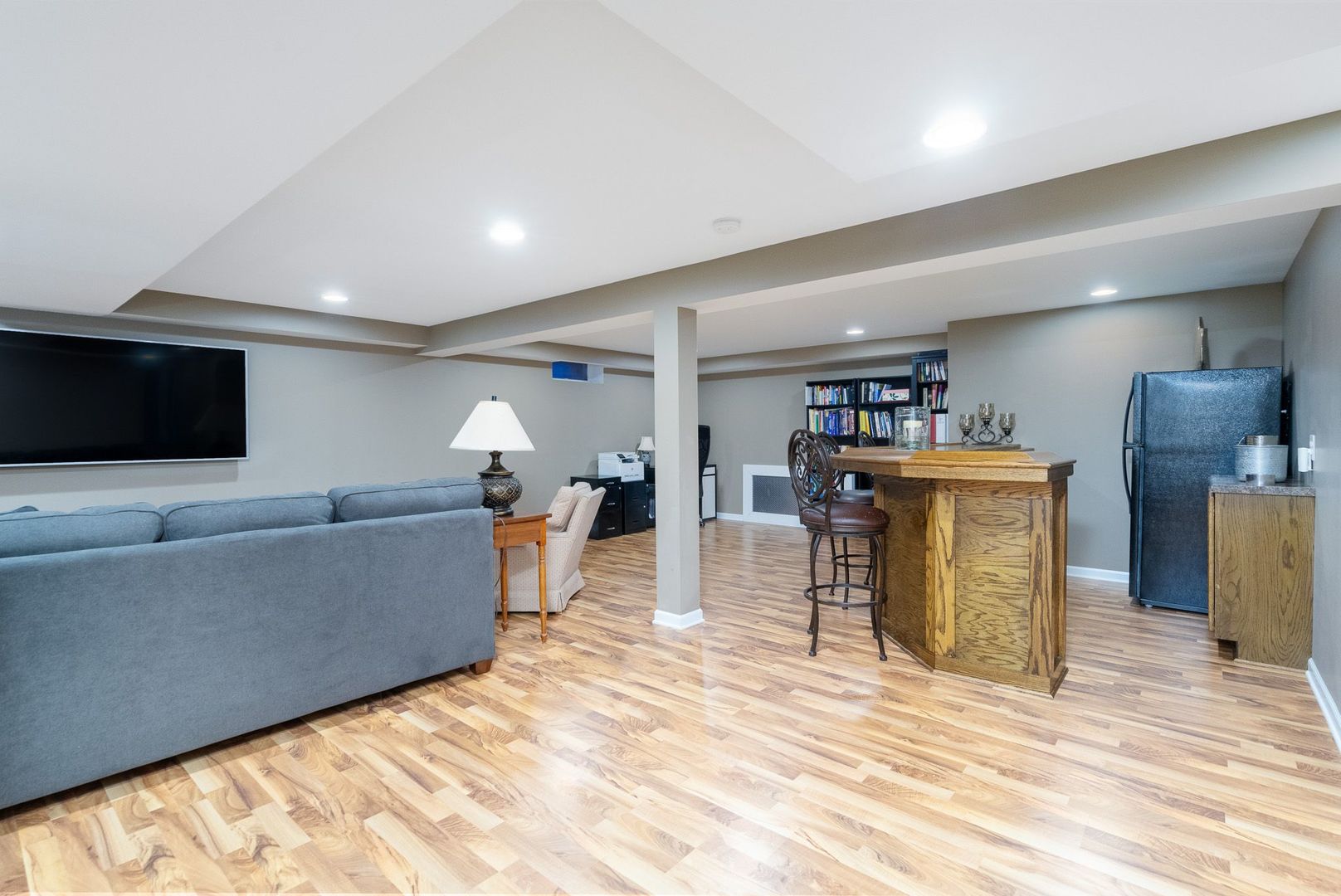 1008 Westminster Road Joliet, IL 60435 - Photo 19 of 28 a living room with furniture and a flat screen tv