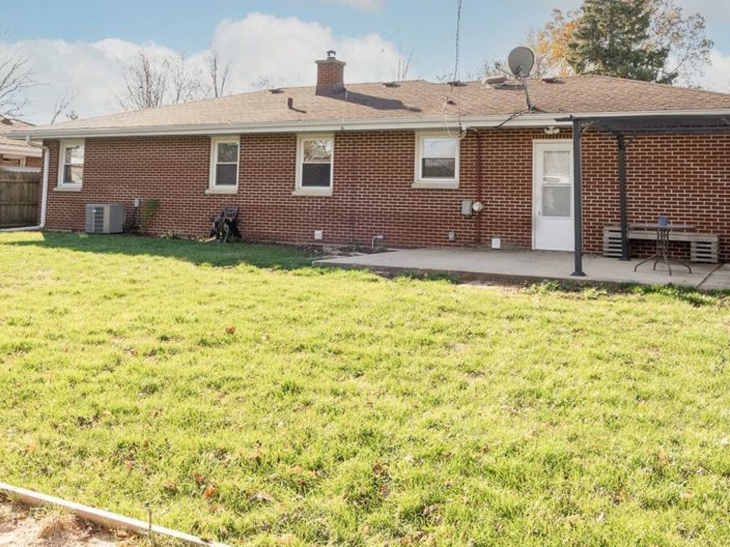 1008 Westminster Road Joliet, IL 60435 - Photo 24 of 28 a front view of a house with a yard