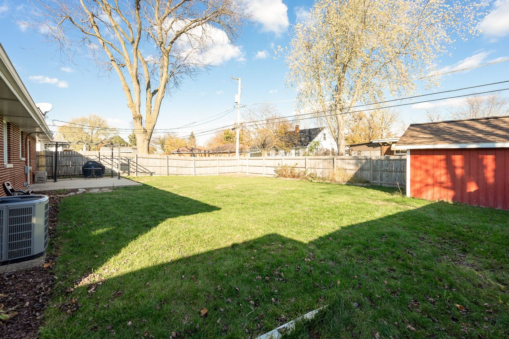 1008 Westminster Road Joliet, IL 60435 - Photo 25 of 28 a view of a yard with a large tree