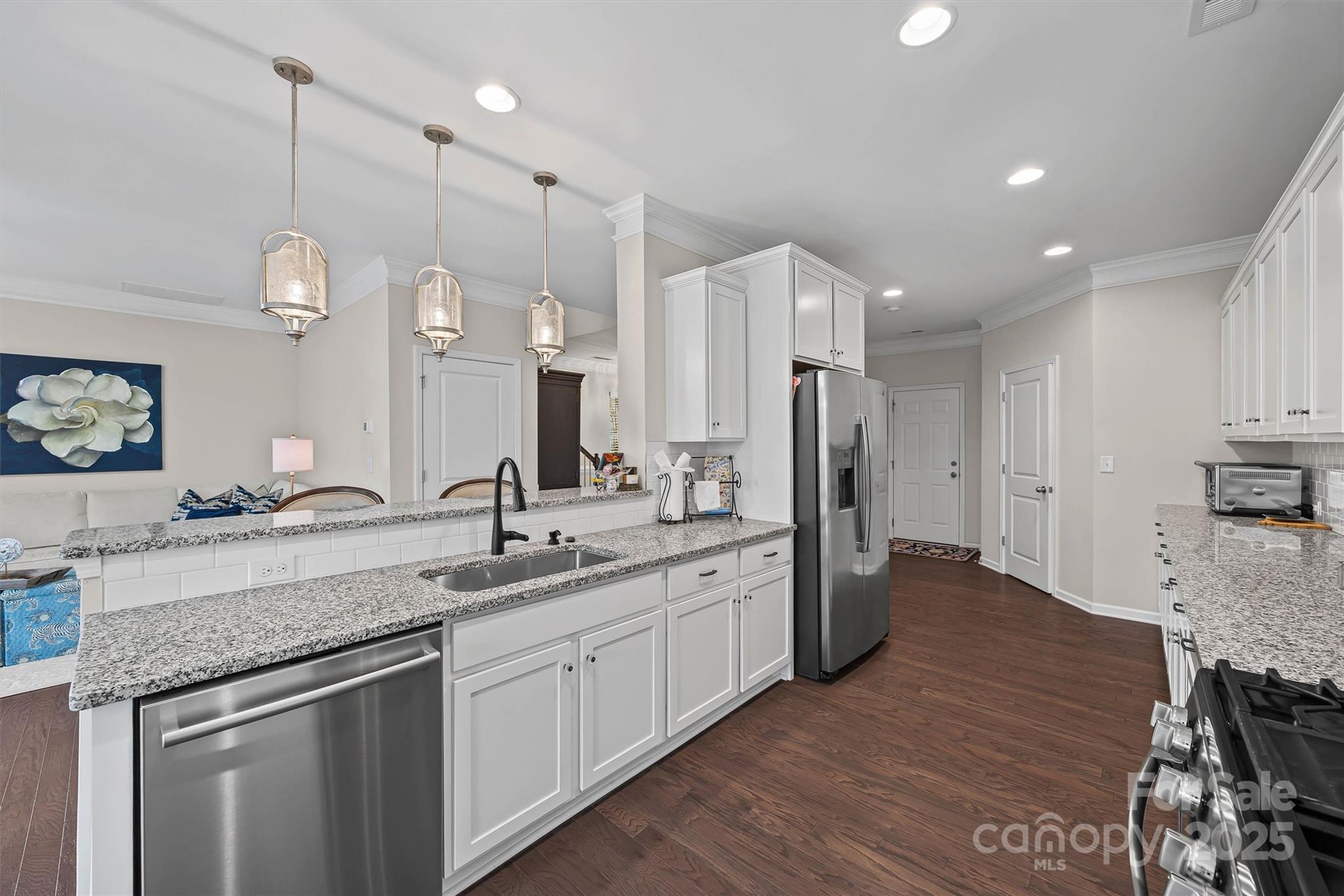 632 Amber Meadows Way Tega Cay, SC 29708 - Photo 14 of 48 a kitchen with a sink stove and refrigerator