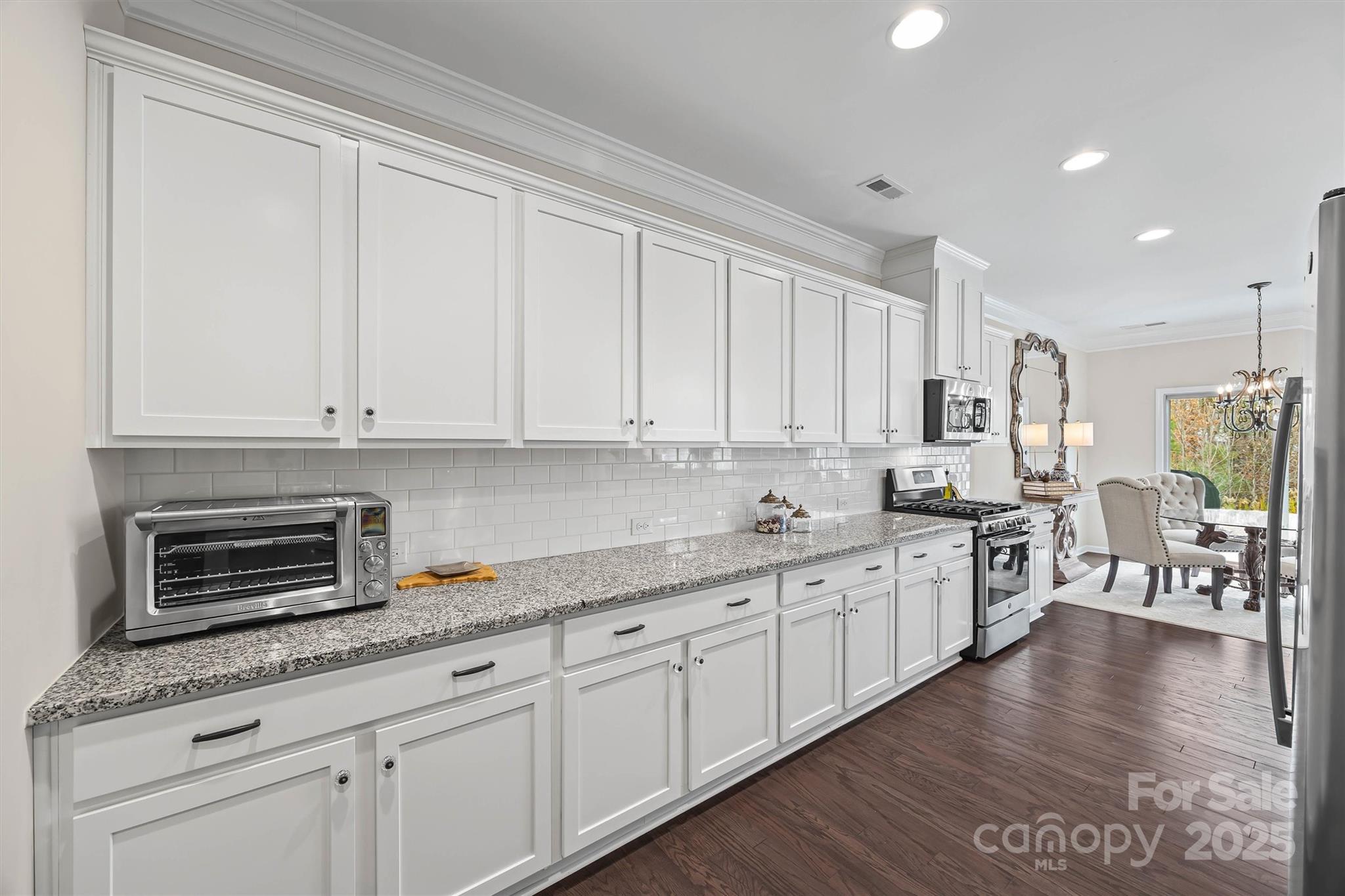 632 Amber Meadows Way Tega Cay, SC 29708 - Photo 16 of 48 a kitchen with appliances a sink and cabinets
