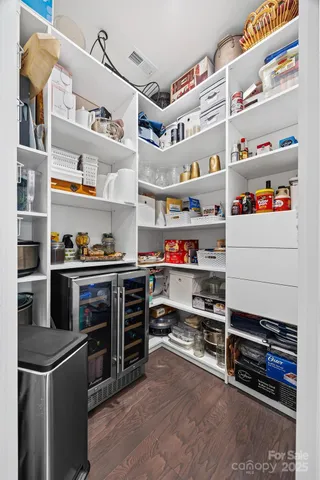 a kitchen with stainless steel appliances and cabinets