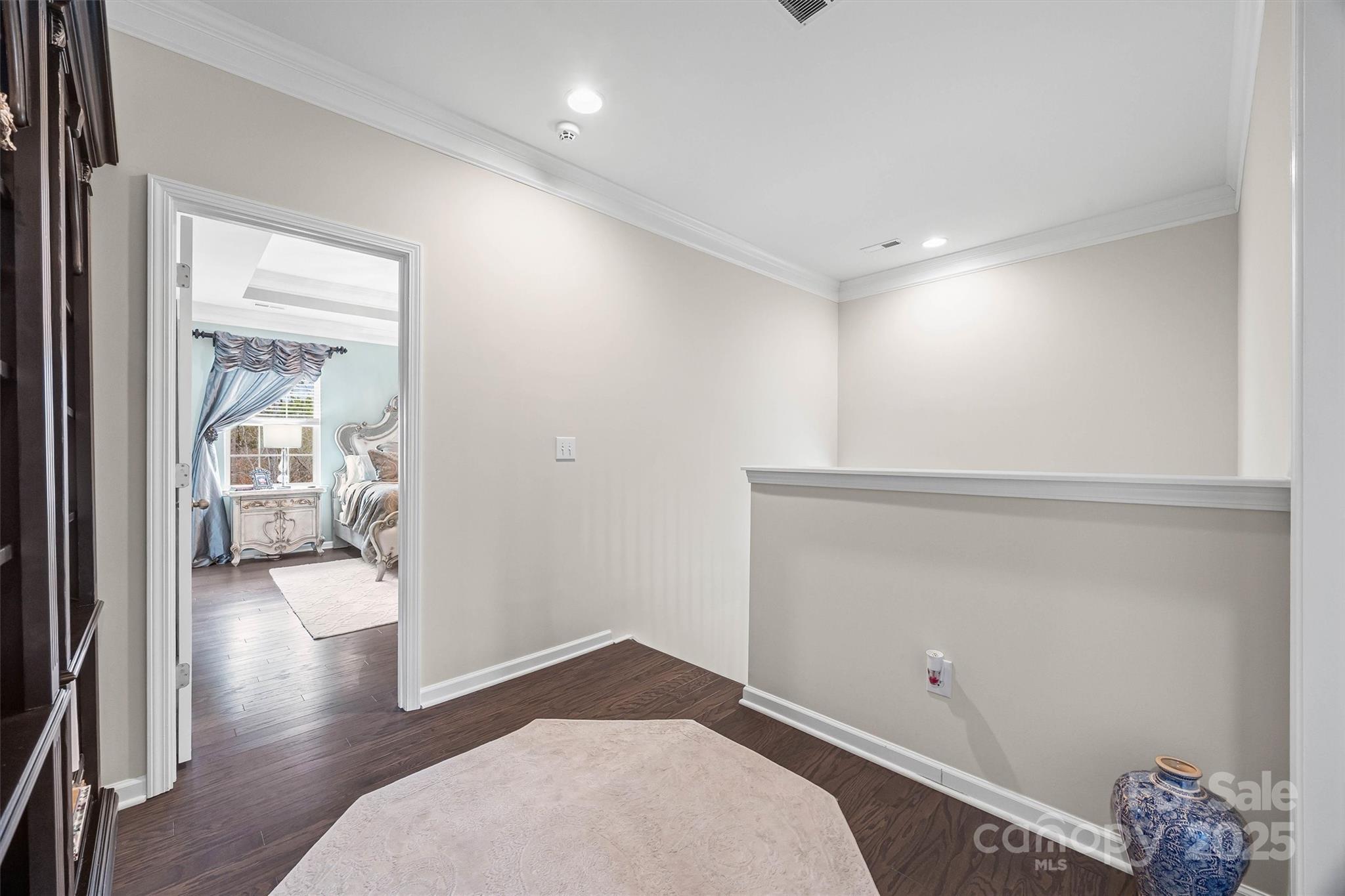 632 Amber Meadows Way Tega Cay, SC 29708 - Photo 19 of 48 wooden floor and chair in a room