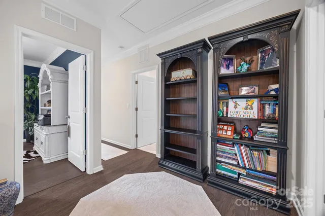 a view of bedroom with furniture and closet