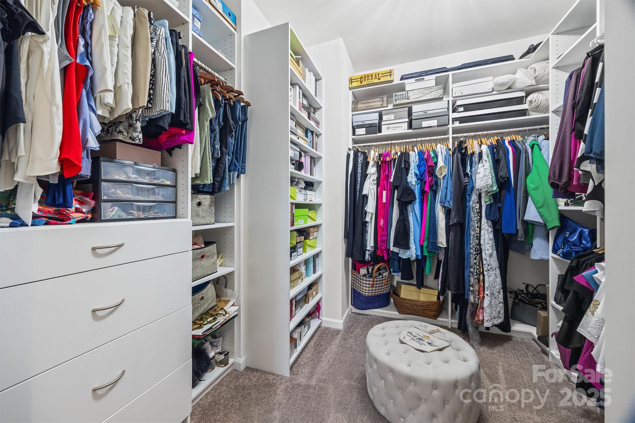 632 Amber Meadows Way Tega Cay, SC 29708 - Photo 25 of 48 a view of walk in closet with clothes and shoes