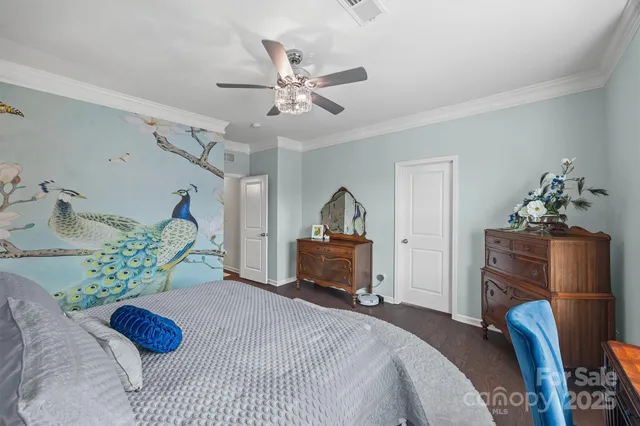 a bedroom with a bed and a table