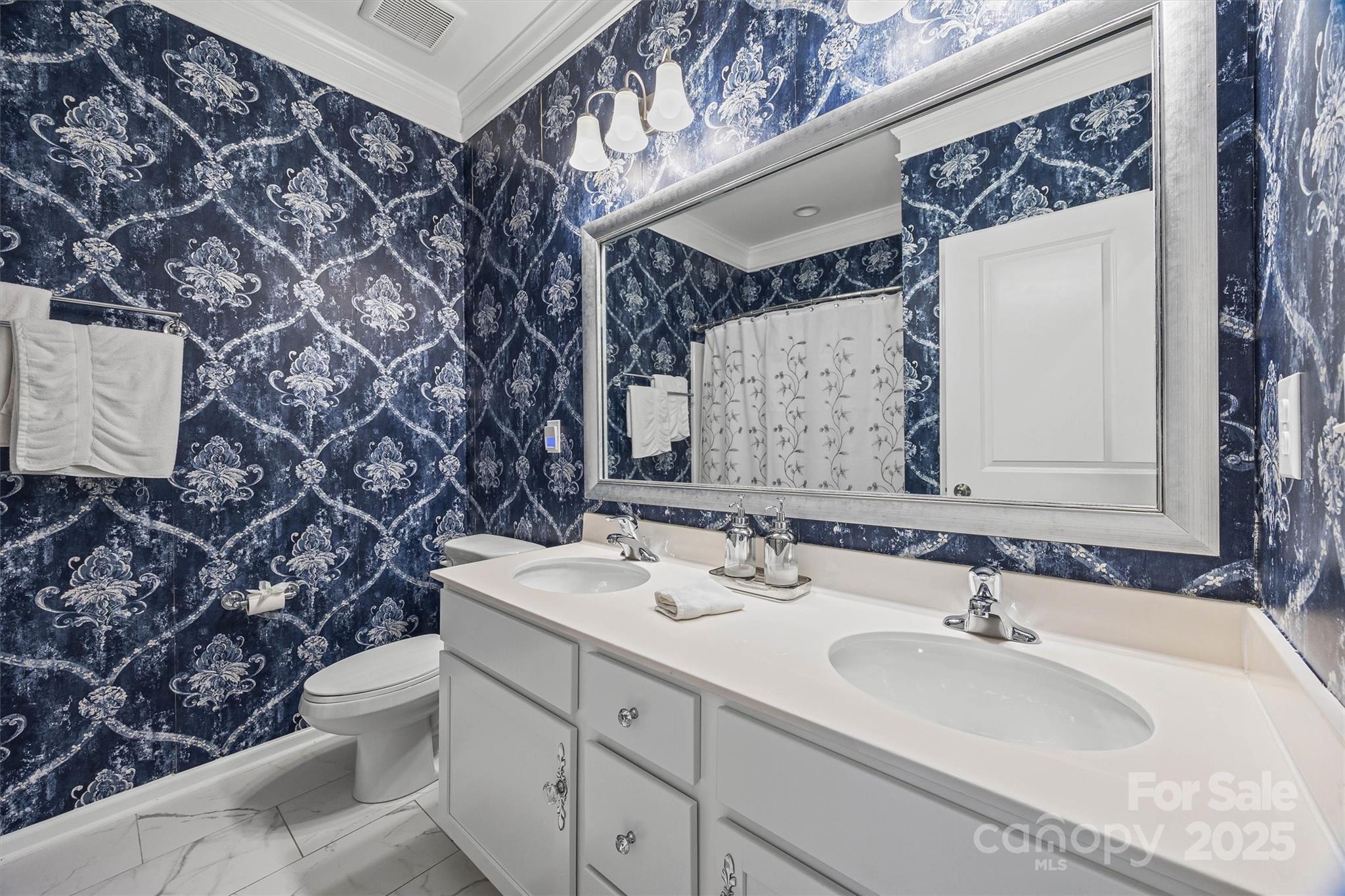 632 Amber Meadows Way Tega Cay, SC 29708 - Photo 28 of 48 a bathroom with a sink and a mirror