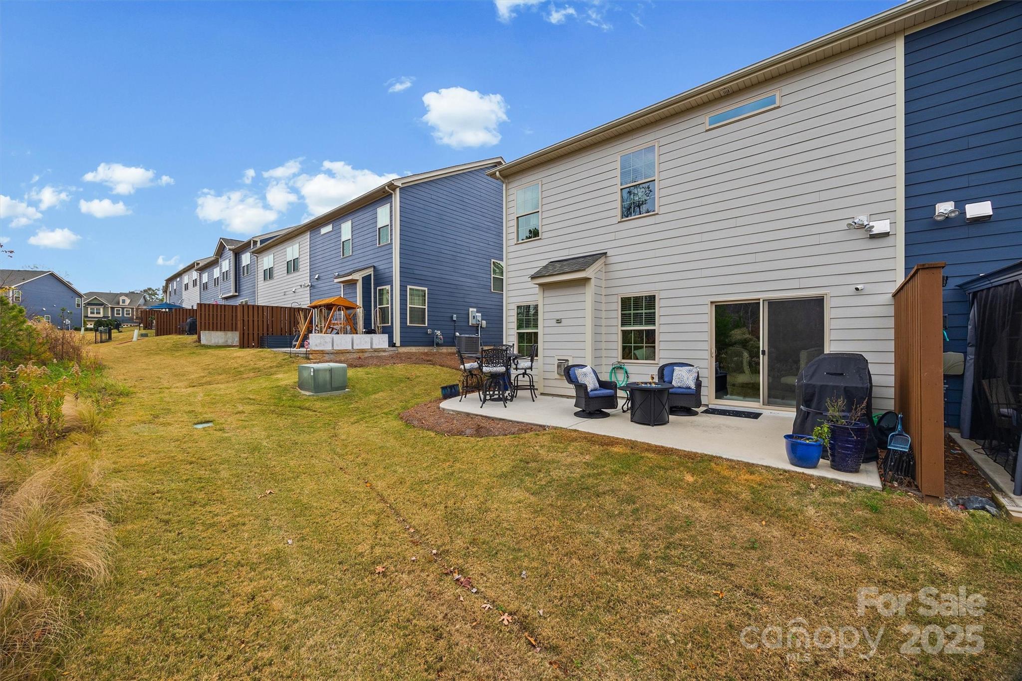632 Amber Meadows Way Tega Cay, SC 29708 - Photo 35 of 48 a view of a house with swimming pool patio and furniture