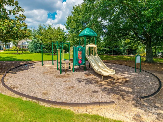 a view of a park with swings