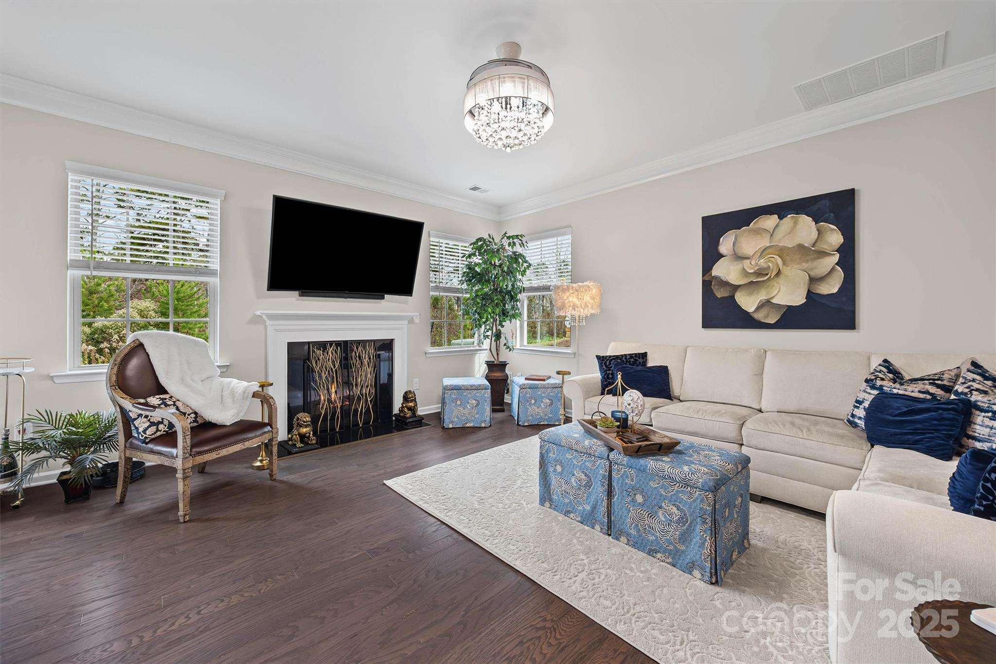 632 Amber Meadows Way Tega Cay, SC 29708 - Photo 6 of 48 a living room with furniture fireplace and a flat screen tv