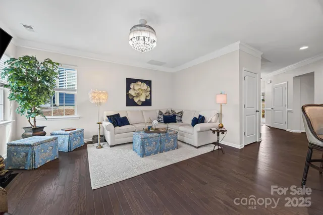 a living room with furniture and a table