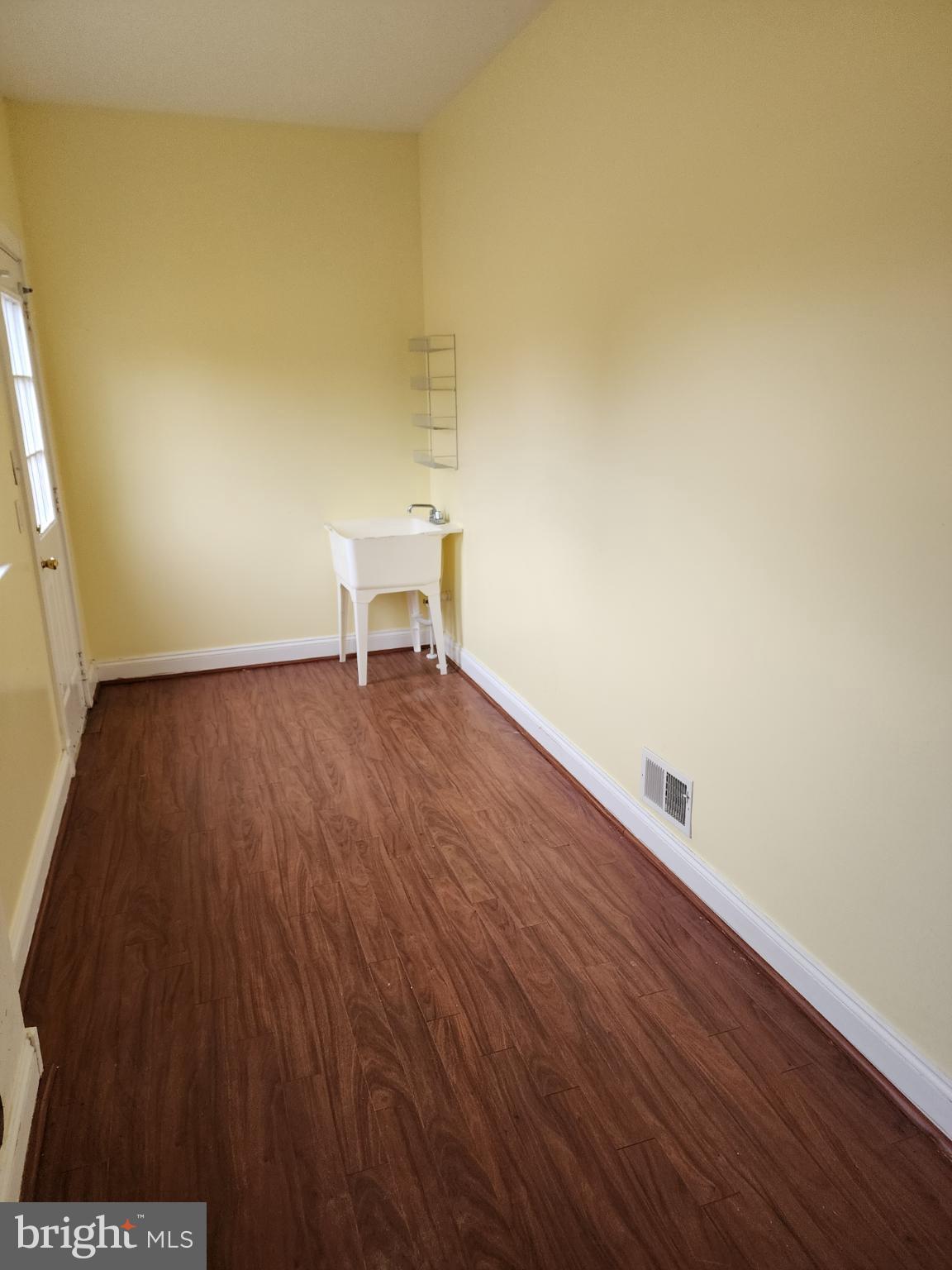 25331 Adams Landing Road Denton, MD 21629 - Photo 12 of 39 a view of a room with wooden floor and bench