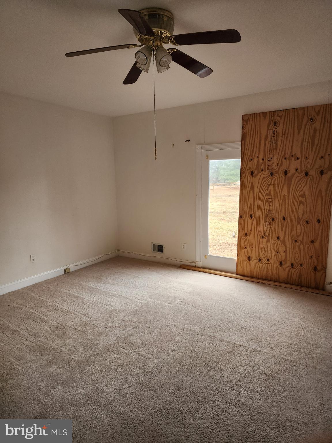 25331 Adams Landing Road Denton, MD 21629 - Photo 16 of 39 a view of an empty room and a window