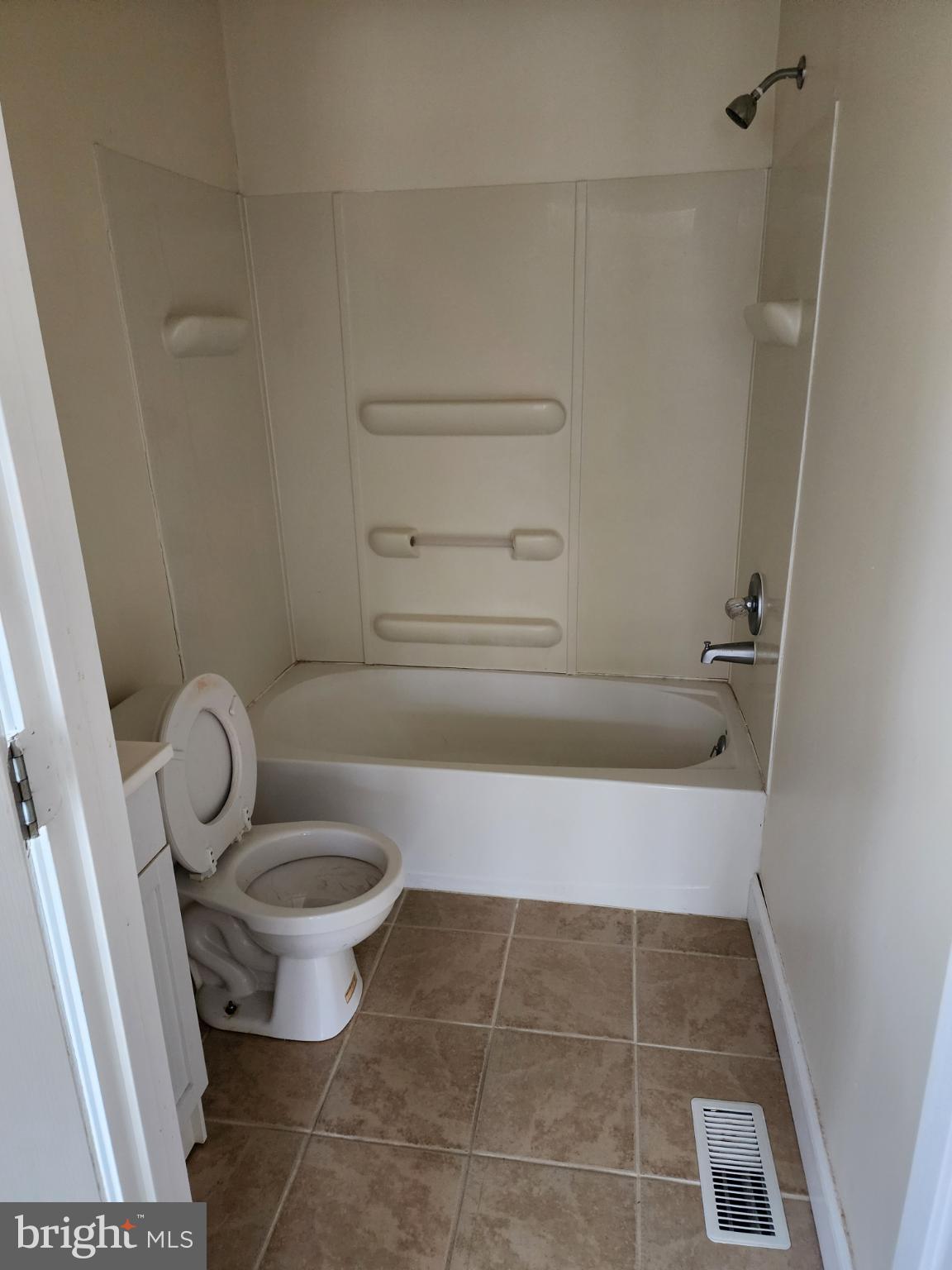 25331 Adams Landing Road Denton, MD 21629 - Photo 34 of 39 a bathroom with a toilet and a bath tub