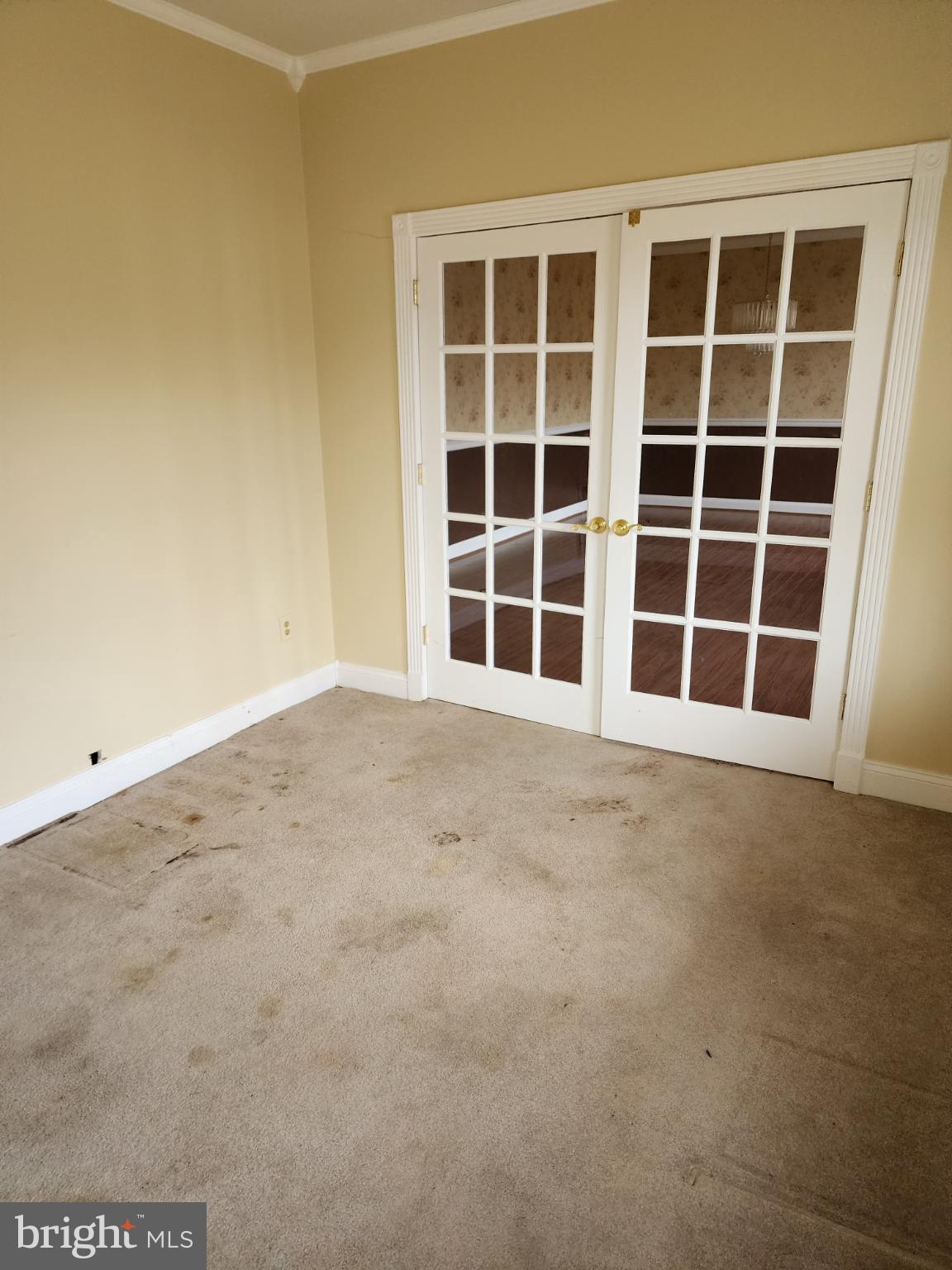 25331 Adams Landing Road Denton, MD 21629 - Photo 5 of 39 a view of an empty room with a garage
