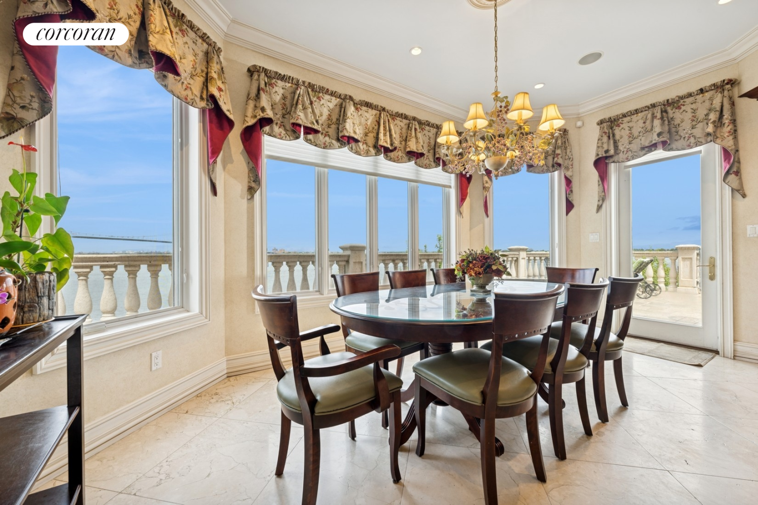 1-15 Samos Lane Queens, NY 11357 - Photo 8 of 32 a view of a dining room with furniture and chandelier
