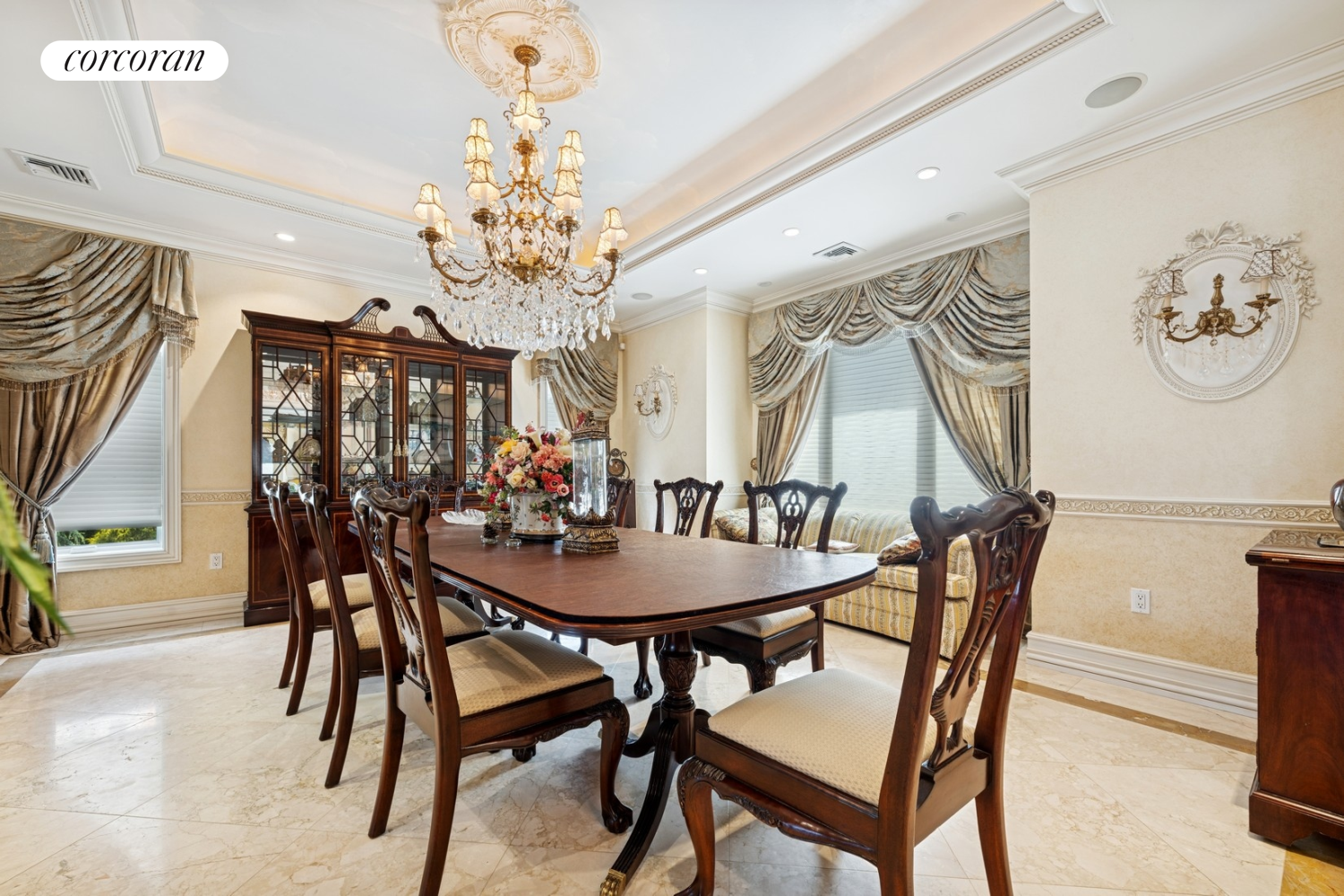 1-15 Samos Lane Queens, NY 11357 - Photo 11 of 32 a view of a dining room with furniture and chandelier