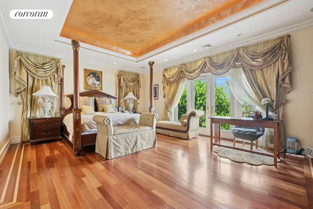 a dining room with furniture and a floor to ceiling window