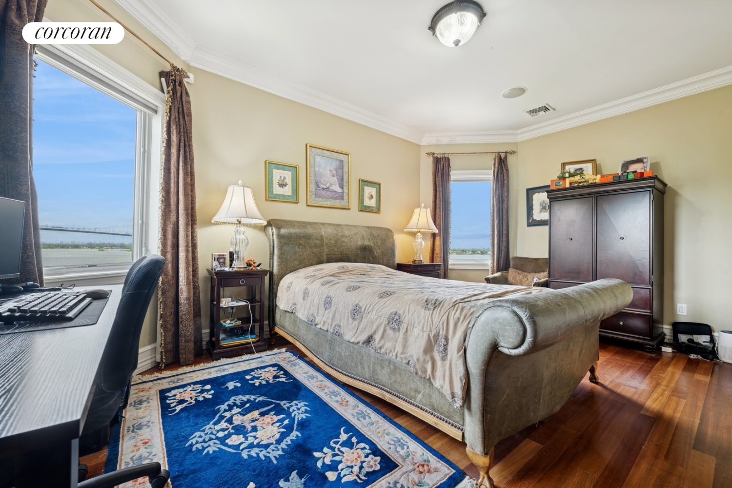 1-15 Samos Lane Queens, NY 11357 - Photo 20 of 32 a bedroom with a bed and a desk