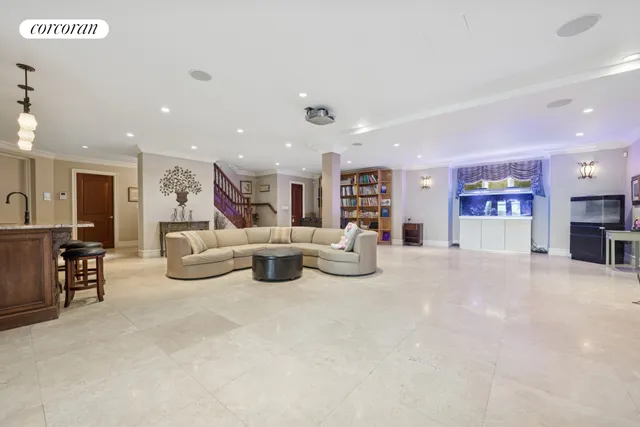 a view of a livingroom with furniture and a flat screen tv