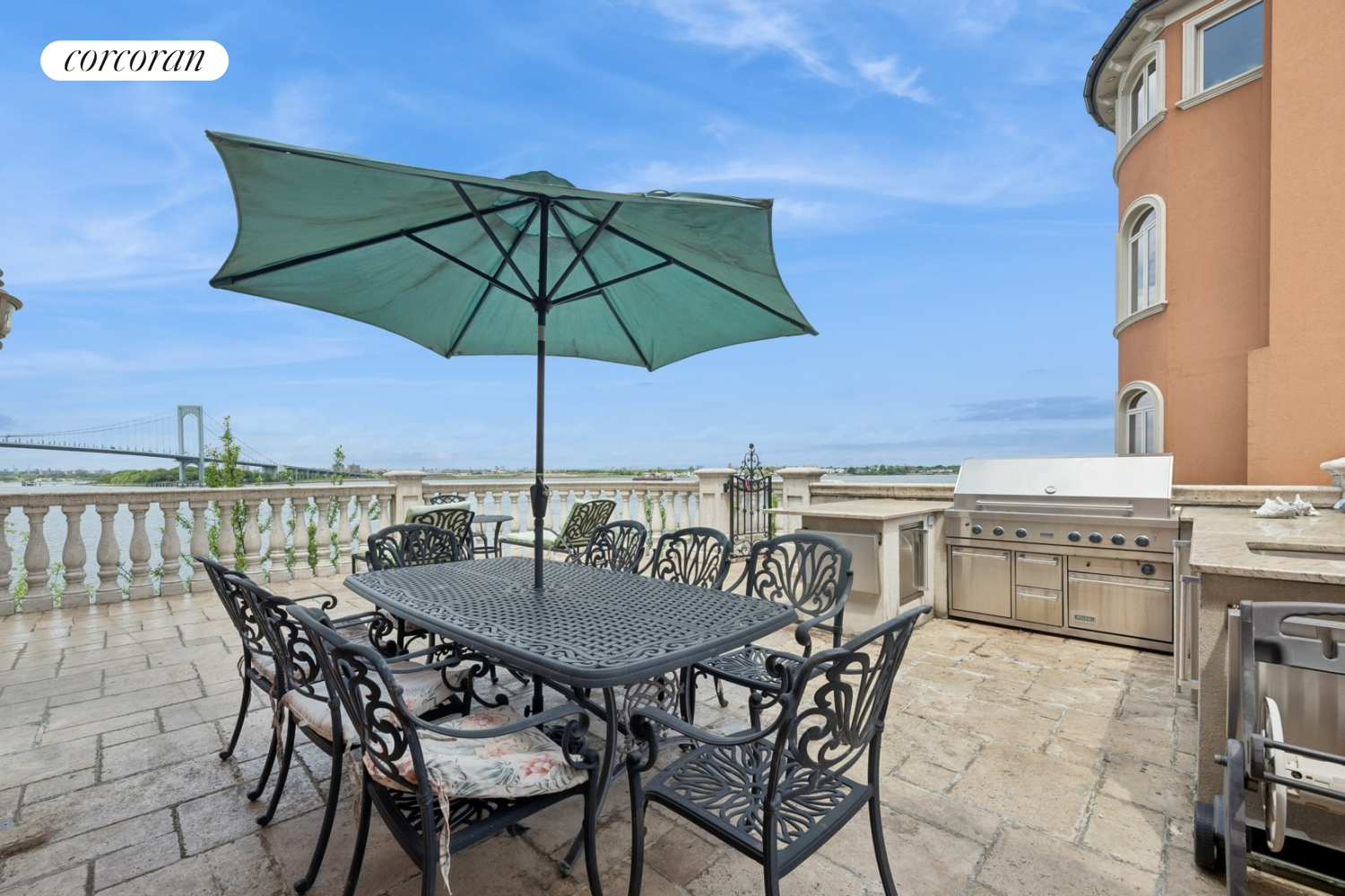 1-15 Samos Lane Queens, NY 11357 - Photo 24 of 32 a view of an outdoor space with furniture and umbrella