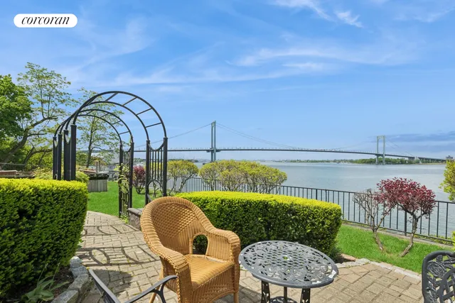 a view of an outdoor space with furniture and umbrella