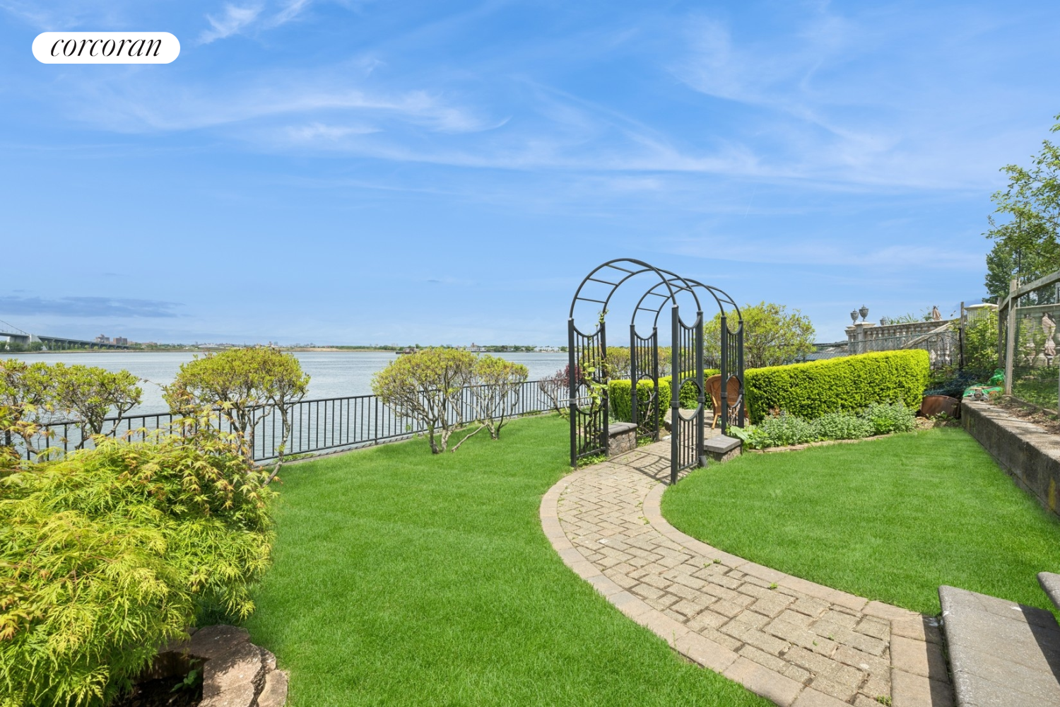 1-15 Samos Lane Queens, NY 11357 - Photo 27 of 32 a view of a garden with a building in the background