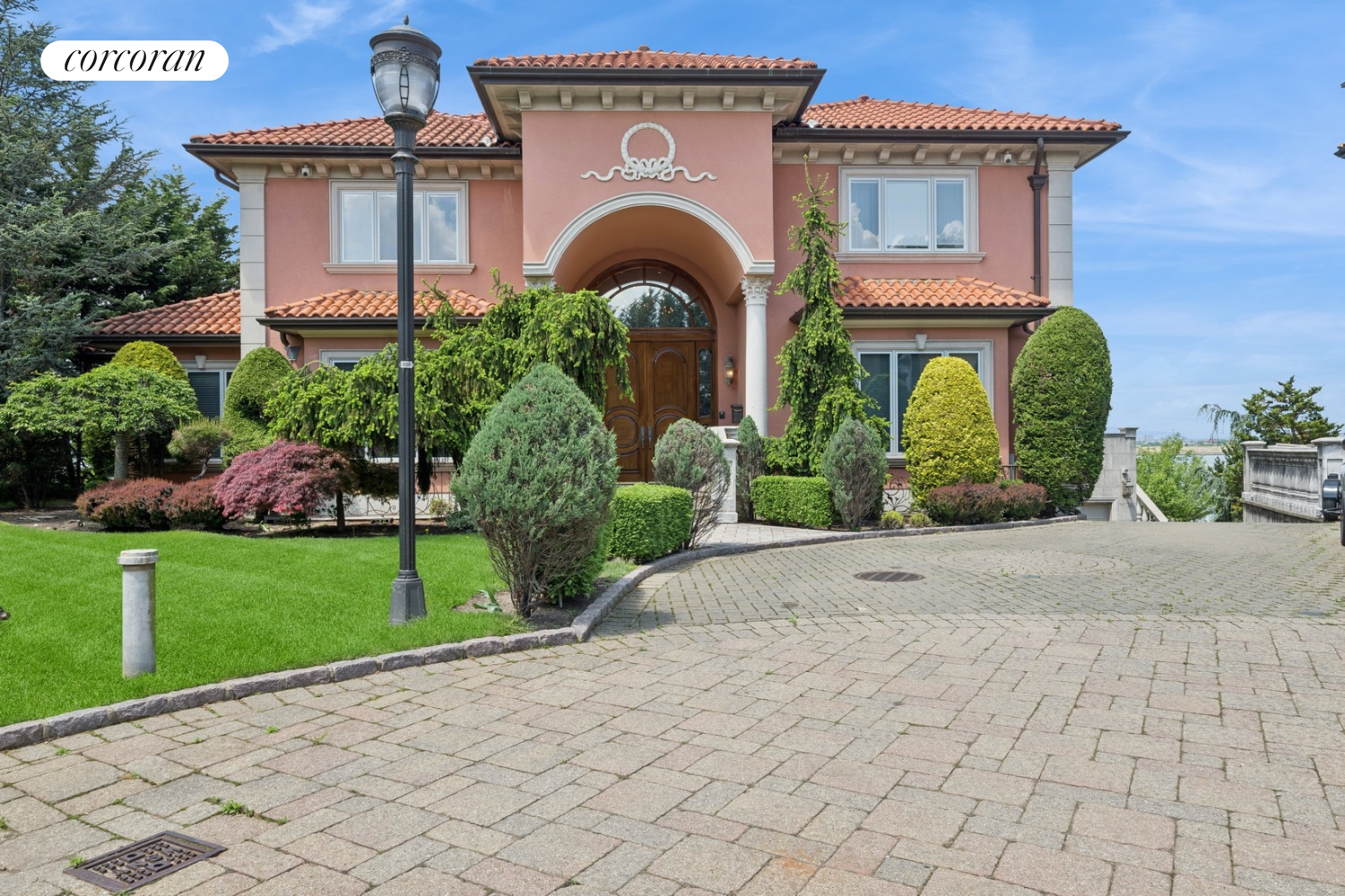 1-15 Samos Lane Queens, NY 11357 - Photo 3 of 32 a front view of a house with garden