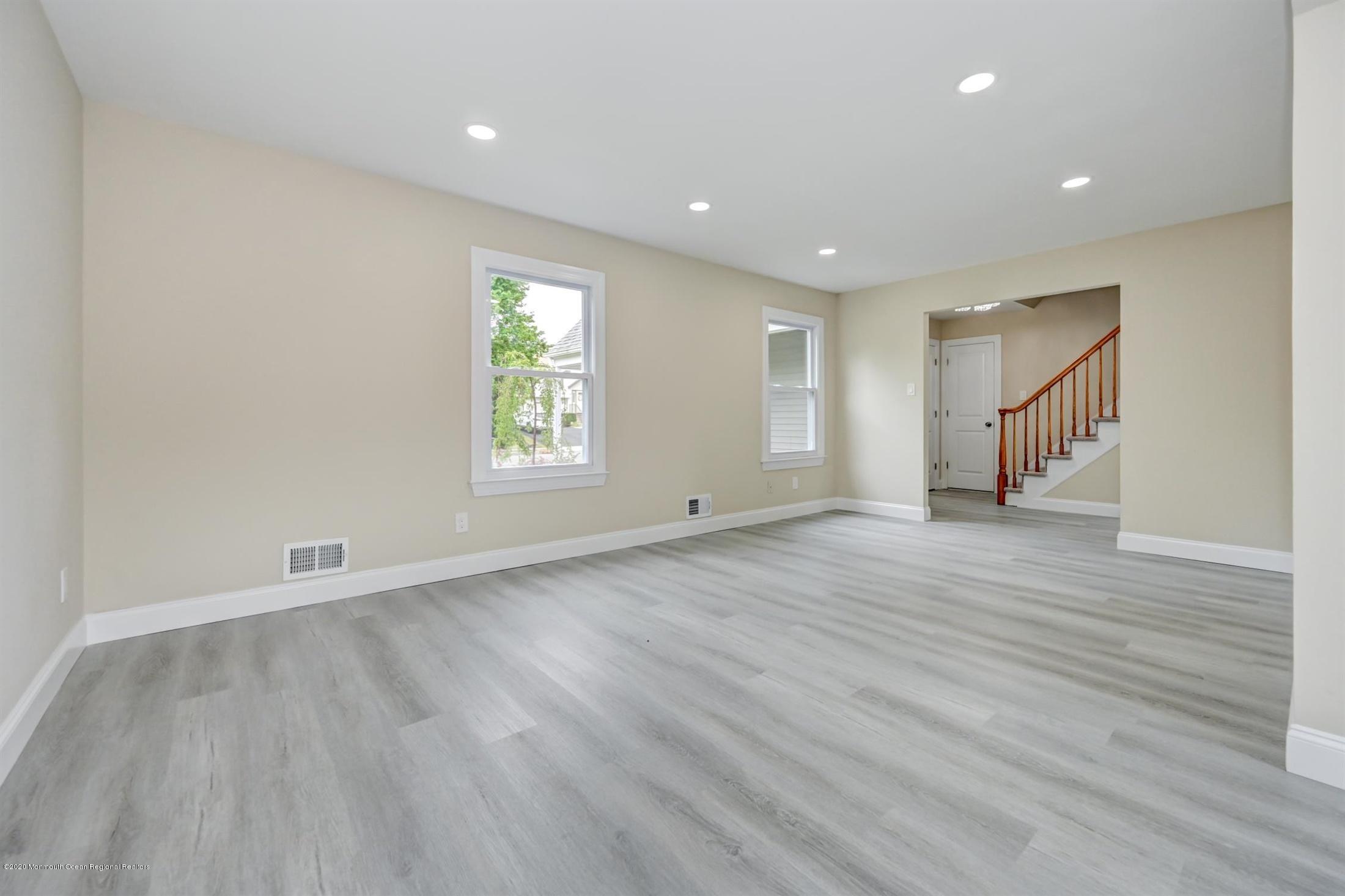 11 Rita Drive Howell, NJ 07731 - Photo 8 of 26 an empty room with wooden floor and window