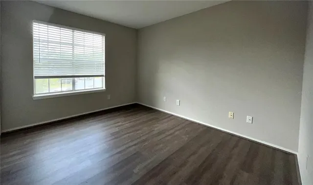 an aerial view of a house with outdoor space and street view