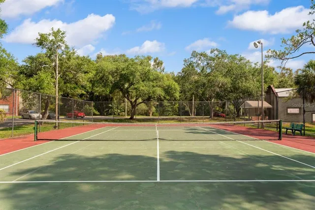 a room with gym equipment and large mirror