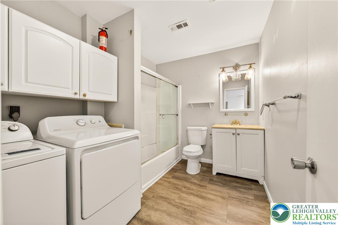 1575 Creekside Road, Unit A2 Whitehall, PA 18052 - Photo 21 of 26 a bathroom with a sink toilet and shower