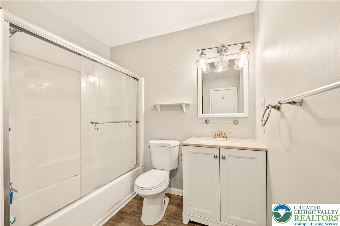 1575 Creekside Road, Unit A2 Whitehall, PA 18052 - Photo 23 of 26 a bathroom with a sink a toilet and shower