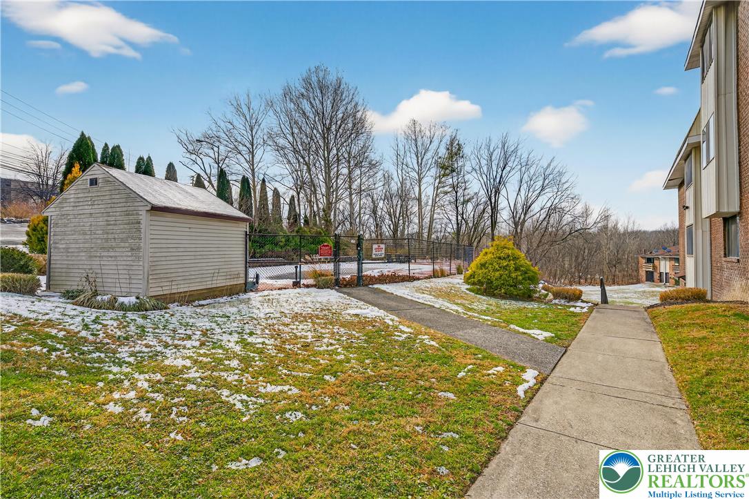 1575 Creekside Road, Unit A2 Whitehall, PA 18052 - Photo 25 of 26 a view of a swimming pool with a patio