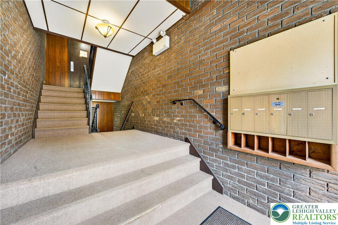 1575 Creekside Road, Unit A2 Whitehall, PA 18052 - Photo 3 of 26 a balcony with a street